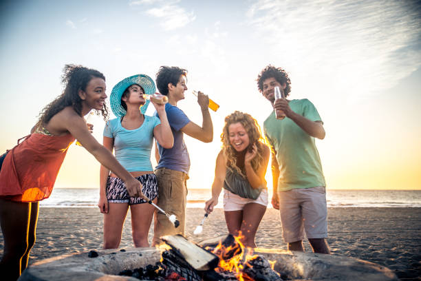 istock Friends partying on the beach 1384629475