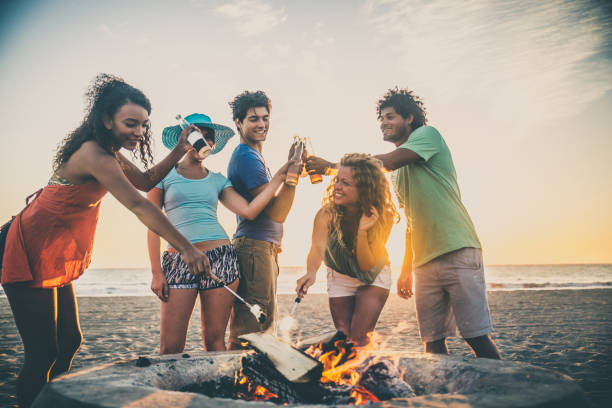 istock Friends partying on the beach 1384630091