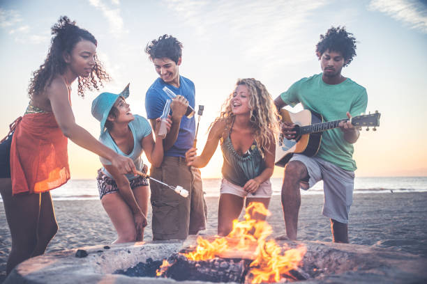 istock Friends partying on the beach 1384630175
