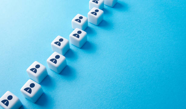 istock Blocks with people in a sequential chain. Human resources and work force. Searching for candidates, hiring new employees for vacancies. Communication. Personnel management. Staffing and recruiting. 1384630344
