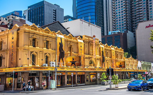 Melbourne, Victoria, Australia, March 12th, 2022: A front view of Her Majesty's Theatre in Melbourne, decorated with the signage of the musical production Hamilton