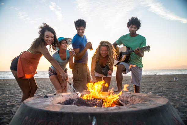 istock Friends partying on the beach 1384630536