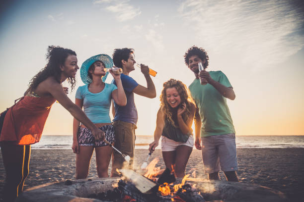istock Friends partying on the beach 1384630543
