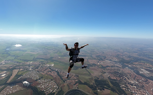 Relaxed and happy skydiver man on a summer day.