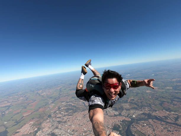 istock Relaxed and happy skydiver man on a summer day. 1384641690