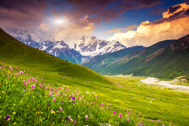mountain landscape Fantastic colorful sunset at the foot of Mt. Shkhara. Dramatic overcast sky. Upper Svaneti, Georgia, Europe. Caucasus mountains. Beauty world. caucasus stock pictures, royalty-free photos & images