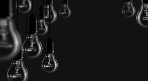 Set of tungsten light bulbs on black background.The concept of "n business ,idea and solution. stock photo