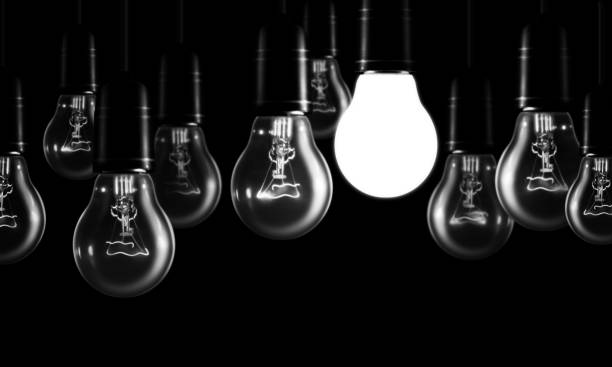 Set of tungsten light bulbs on black background.The concept of "n business ,idea and solution. stock photo