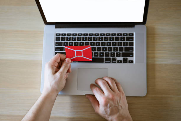 male hands behind laptop with credit card, online shopping concept