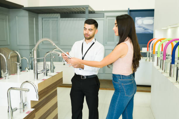 istock Salesperson speaking with a female customer 1384646888