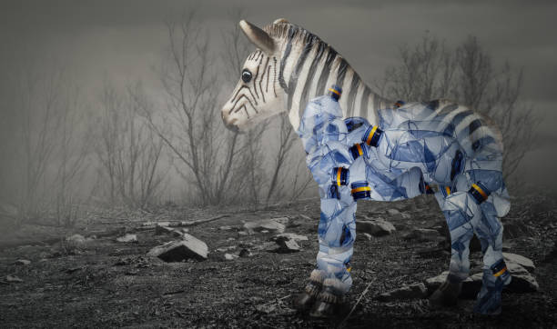 Creative double exposure of zebra (toy model) with used  plastic bags,arid landscape.Concept background for environmentalism and plastic awareness.
