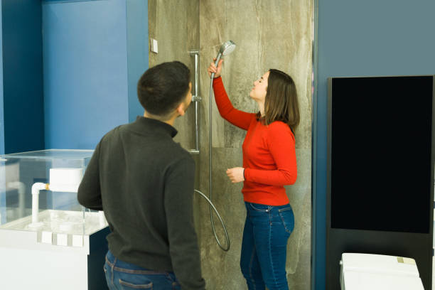 istock Husband and wife remodeling the bathroom 1384647028