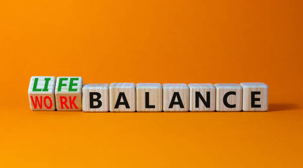 istock Work life balance symbol. Turned wooden cubes and changed concept words Work balance to Life balance. Beautiful orange table orange background. Business work life balance concept. Copy space. 1384648607