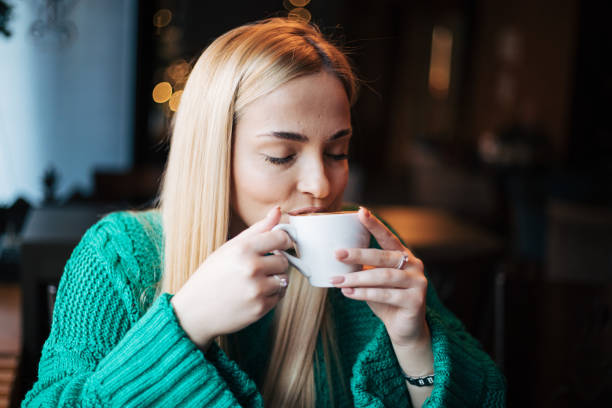 Pretty blonde woman in a cafe.
