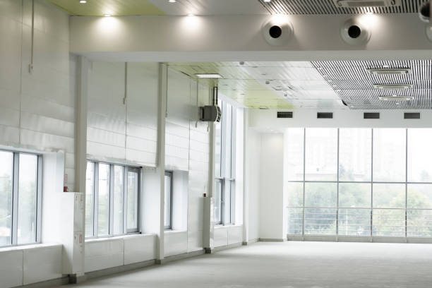 istock Interior empty corridor, lobby hall of modern office building with glass wall and sunlight shine through 1384657322
