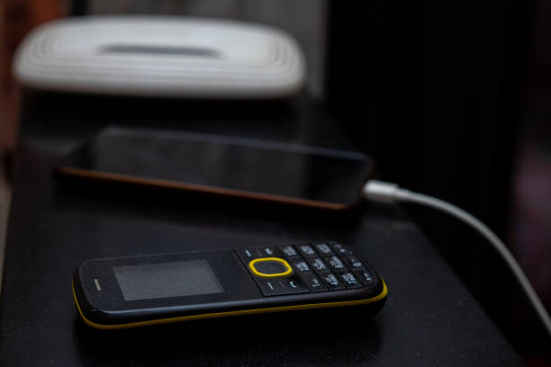 istock Button mobile phone, smartphone and router lie on the table 1384658335