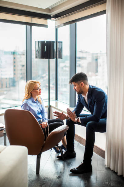 istock Coworkers preparing for a meeting in a hotel suit 1384669876