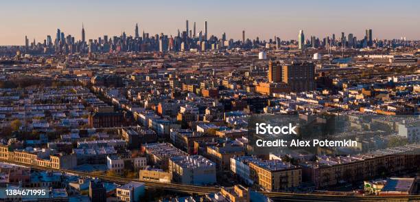 Manhattan Midtown Skyline Includes The Empire State Building Hudson Yards And Other Iconic Skyscrapers View Over The Residential District Of Bushwick Brooklyn At Sunset Extralarge Highresolution Stitched Panorama Stock Photo - Download Image Now