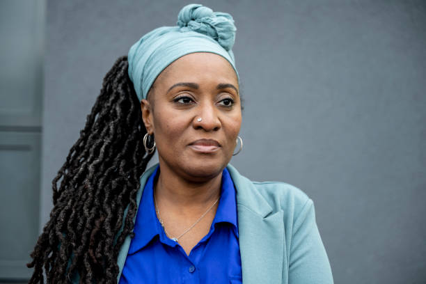 Mature Black businesswoman against gray background
