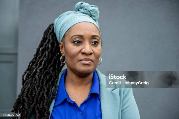 Mature Black Businesswoman Against Gray Background Stock Photo - Download Image Now - One Woman Only, Black People, Portrait