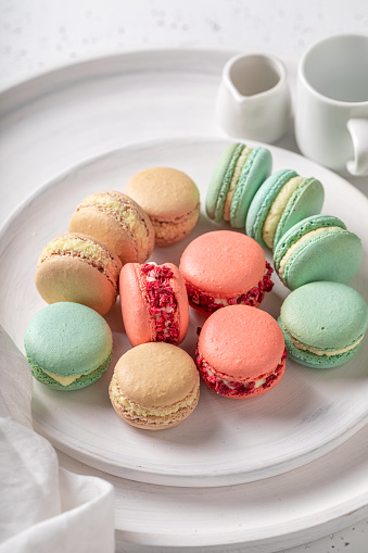 Tasty and colorful macaroons made of meringues and creams. Colorful fruit-flavored macaroons.