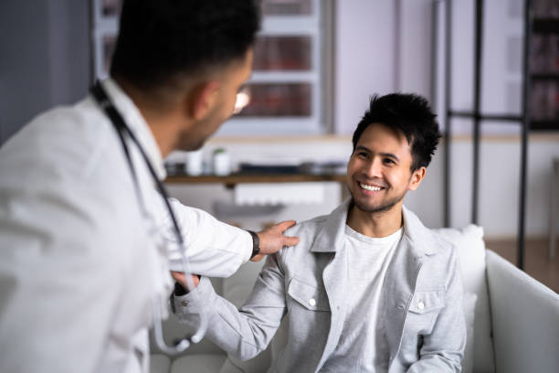 istock Doctor With Young Asian Patient Living 1384681304