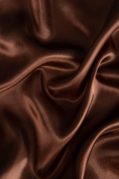 istock Smooth elegant brown silk or satin texture can use as abstract background. 1384687370