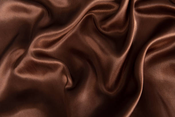 istock Smooth elegant brown silk or satin texture can use as abstract background. 1384687379