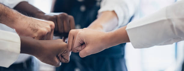 istock Panoramic teamwork business join hand together concept, Business team standing hands together, Volunteer charity work. People joining for cooperation success business. 1384691837