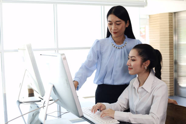 istock The office lady is working hard to help customers. 1384696967