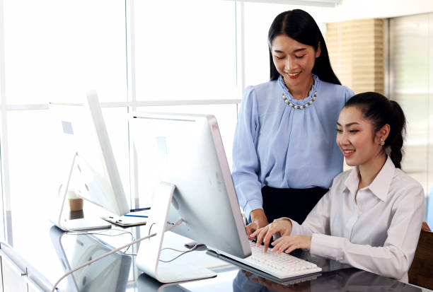 istock The office lady is working hard to help customers. 1384697492