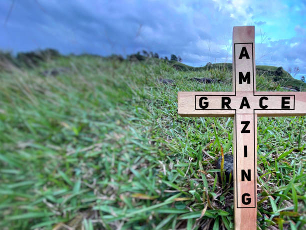 Christianity Concept Amazing grace text background on cross. Christianity Concept. Stock photo. new testament stock pictures, royalty-free photos & images