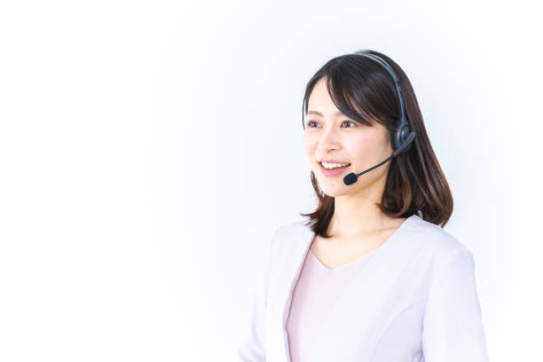 istock Young Woman Answering Phone at Call Center 1384698631