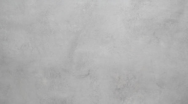 istock Light grey concrete stone surface paint wall background, Grunge cement paint texture backdrop, Gray rough concrete stone wall background, Copy space for interior design background, banner, wallpaper 1384700465