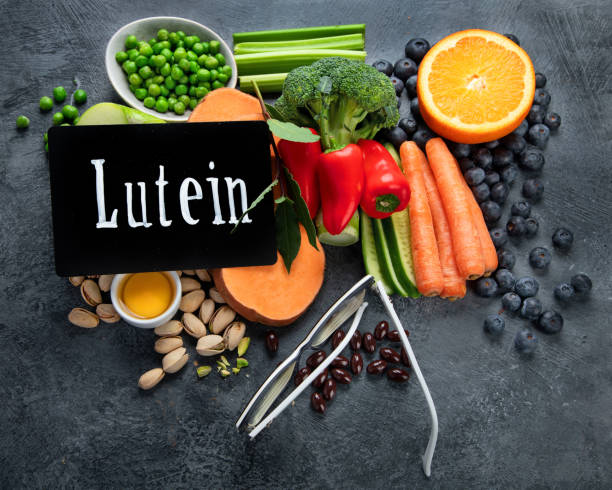 istock Foods high in lutein on dark background. 1384701407