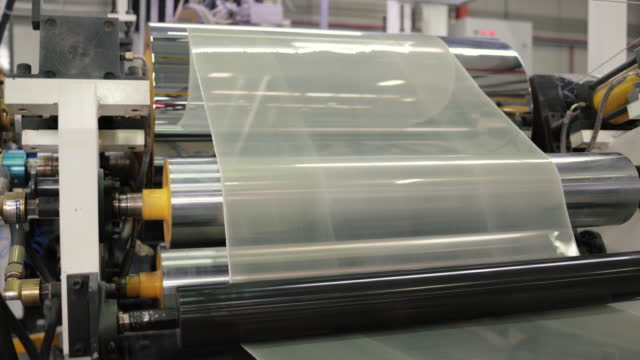 Detail of production line of rolled up laminate plastic manufacturing, Process of producing lunch boxes from recycled plastic material