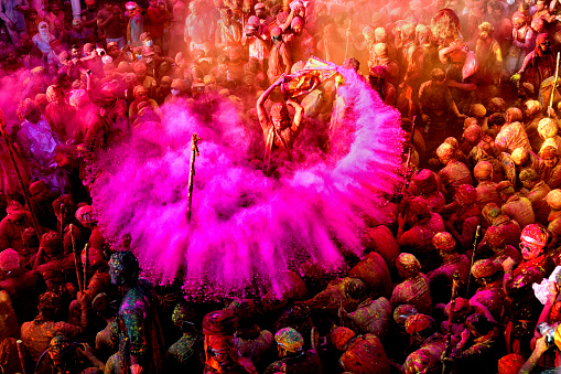 Hindu devotees play with colorful powders (Gulal) at the Radharani Temple of Nandgaon during the festival. Holi Festival of India is one of the biggest colorful celebrations in India as many Tourists and devotees gather to observe this colorful event. Marking the beginning of spring, the festival celebrates the divine love of Radha and Krishna and represents the victory of good over evil.