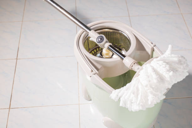 istock Mop with microfiber head spinning on the bucket 1384707813