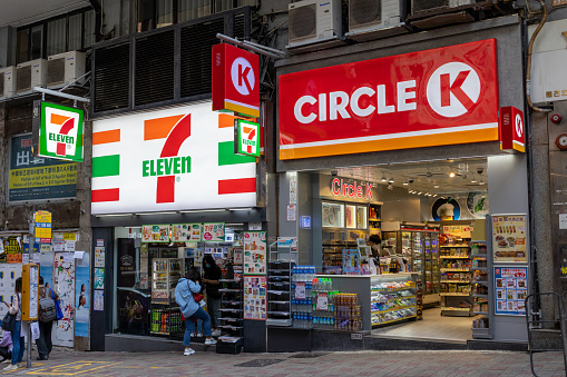 Hong Kong - March 10, 2022 : Circle K and 7-Eleven convenience stores in Hong Kong. Both are international chain of convenience stores.