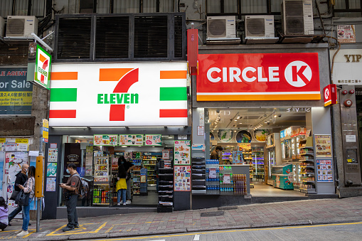 Hong Kong - March 10, 2022 : Circle K and 7-Eleven convenience stores in Hong Kong. Both are international chain of convenience stores.