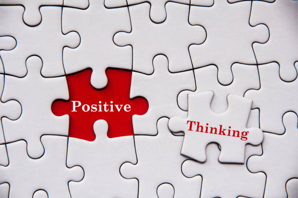 istock Positive thinking text on missing jigsaw puzzle. Motivational and inspirational concept 1384714618