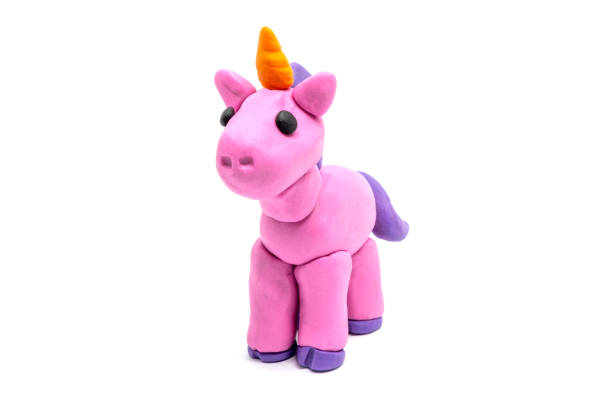 istock Play dough unicorn on white background. Handmade clay plasticine 1384730578
