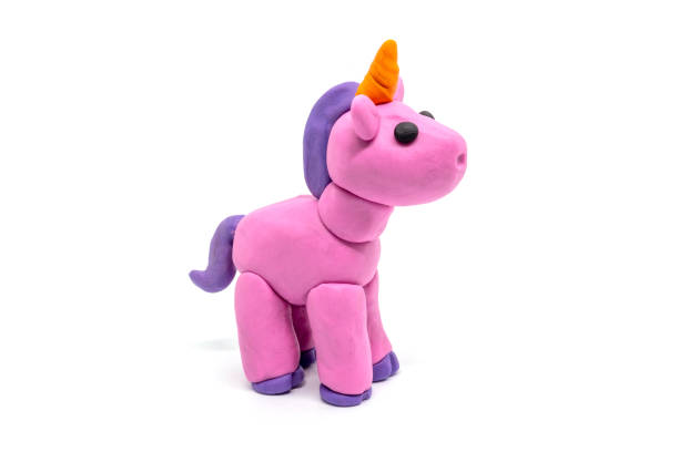 istock Play dough unicorn on white background. Handmade clay plasticine 1384730579