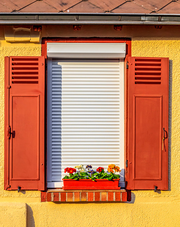 Window with wooden blinds of a rural house in Brou, a small town located in Eure et Loir Department in Central France. This image is part of my project \