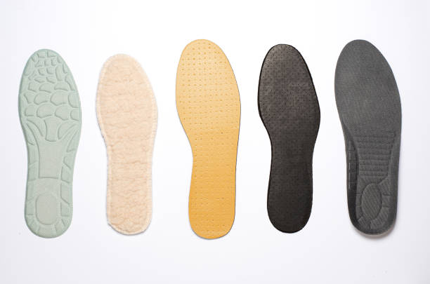 istock Different insoles for shoes. White background. Close up 1384748744