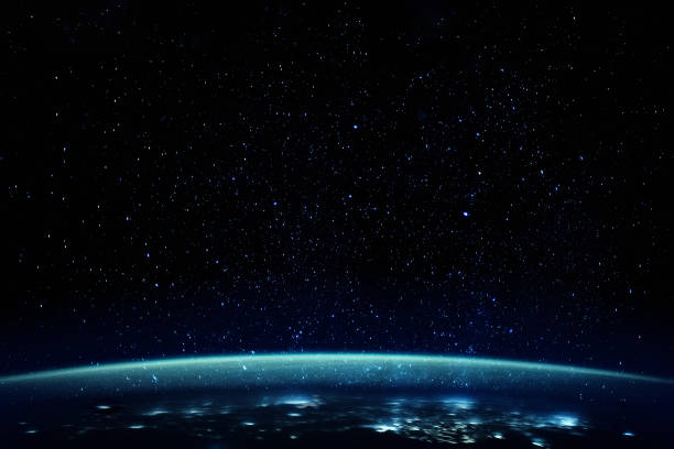 istock Stars over planet with blue atmosphere 1384749575