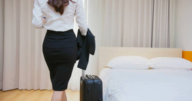 istock businesswoman enter hotel room 1384752640