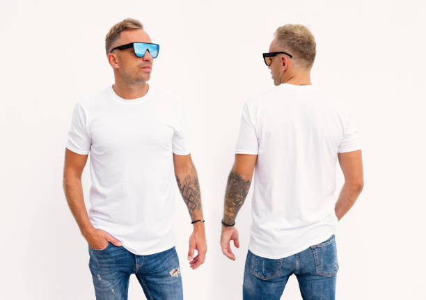 istock Man wearing blank white t-shirt, front and back view 1384755006
