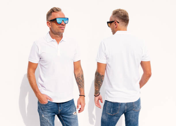 istock Man wearing blank white shirt, front and back view 1384755010