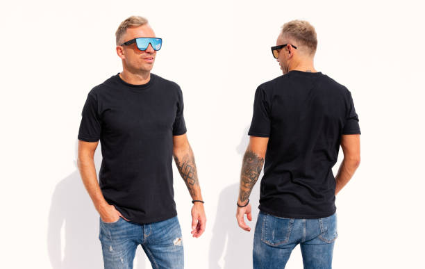 istock Man wearing black t-shirt, front and back view 1384755023